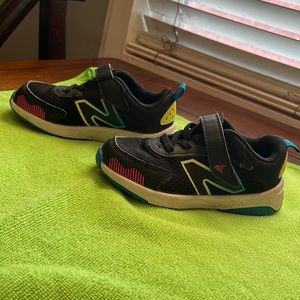 Toddler size 8 New Balance shoes in good condition.